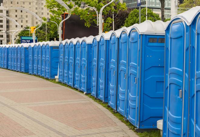 a clean row of portable restrooms for outdoor weddings or festivals in Burlington